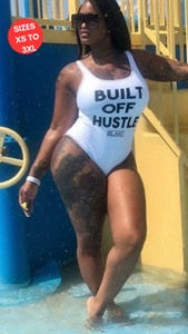 White Blakk Apparel bathing suit with black Built Off Hustle Bathing Suit  A stylish and empowering swimsuit featuring the 'Built Off Hustle' design. Perfect for those who embrace hard work and determination.