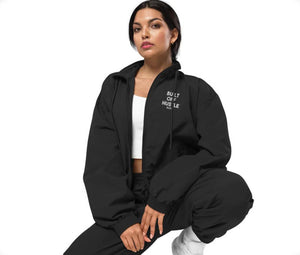 Blakk Apparel tracksuit with 'Built Off Hustle' logo - A black tracksuit featuring the phrase 'Built Off Hustle' in stylish white lettering, embodying the brand's ethos of hard work, determination, and success.