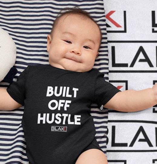 Blakk Apparel baby’s soft snap onesie with Built off hustle logo on chest mommy/daddy and me clothing