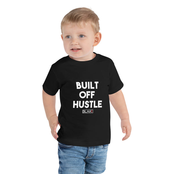 Blakk Apparel unisex toddler soft cotton t-shirt with Built off hustle logo on chest and Blakk logo in white lettering on the back mommy/daddy and me clothing