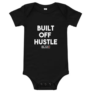 Blakk Apparel baby’s soft snap onesie with Built off hustle logo on chest mommy/daddy and me clothing