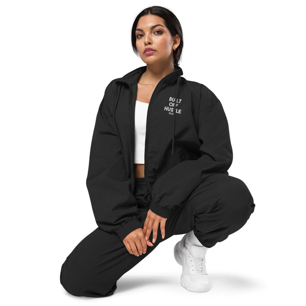 Blakk Apparel recycled tracksuit jacket with 'Built Off Hustle' logo - black tracksuit jacket featuring the phrase 'Built Off Hustle' in stylish white lettering, embodying the brand's ethos of hard work, determination, and success.