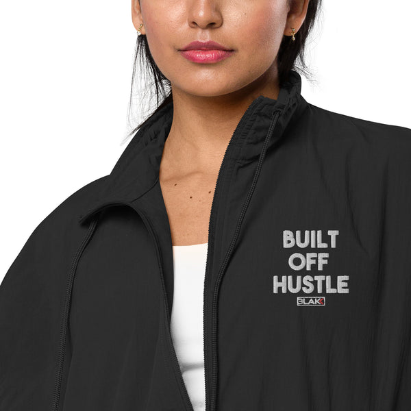 Blakk Apparel recycled tracksuit jacket with 'Built Off Hustle' logo - black tracksuit jacket featuring the phrase 'Built Off Hustle' in stylish white lettering, embodying the brand's ethos of hard work, determination, and success.